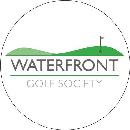 A circular logo for Waterfront Golf Society, featuring a green golf course landscape with a flag on a white background and gray text.